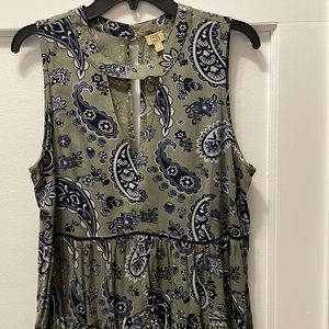Never worn!  Casual top, lots of detail, never worn. Belk